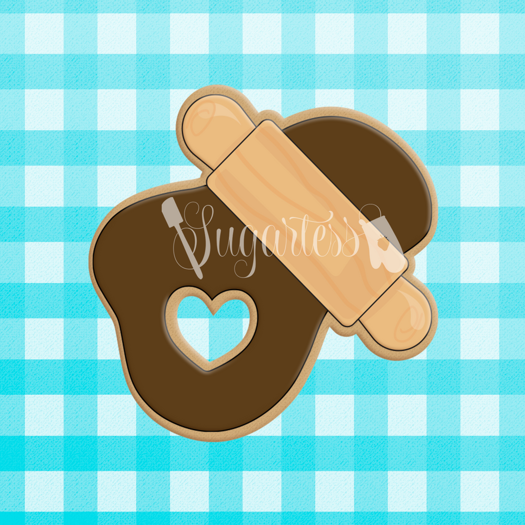 Sugartess custom cookie cutter in shape of Rolling Pin Over Cookie Dough with Cutout Heart Shape.