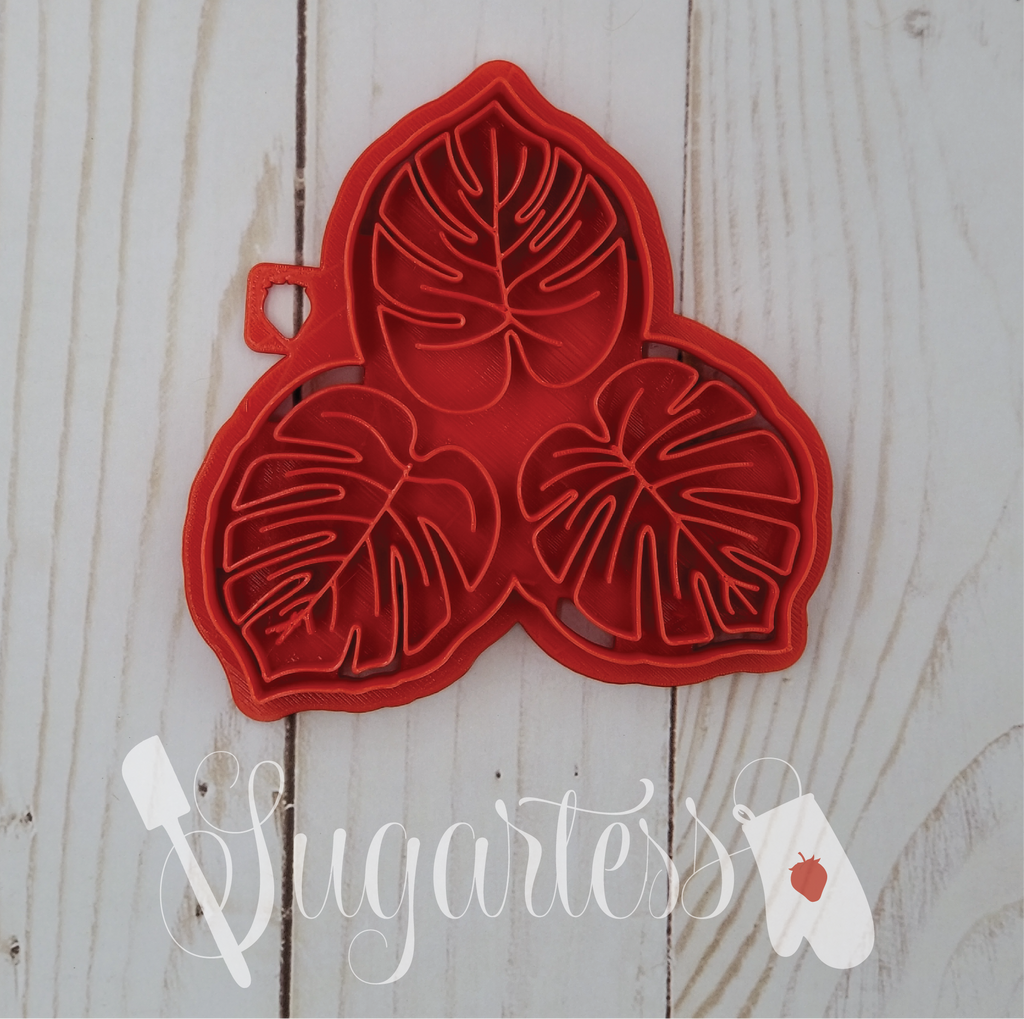 Sugartess custom cookie cutter and stamp in shape of tropical leaf trio.