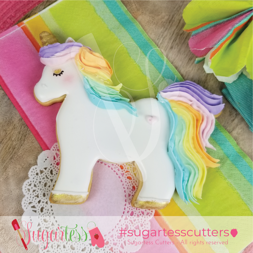 Sugartess standing unicorn cookie decorated with pastel royal icing colors.